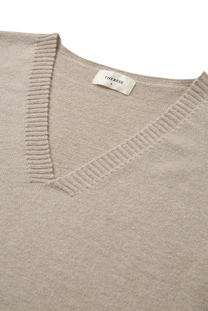 Kortærmet strikvest i ren cashmere med V-udskæring i lysebrun nuance.