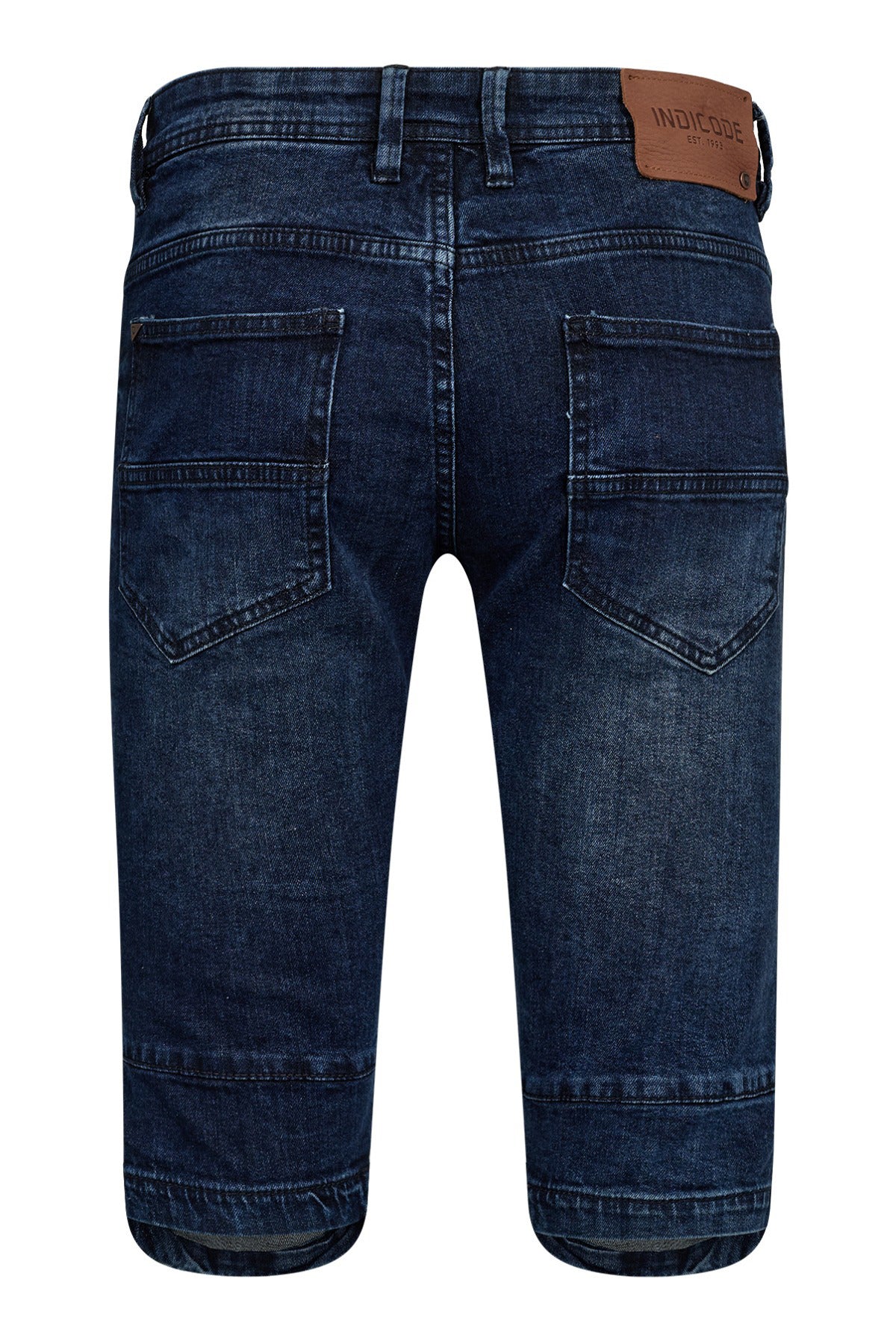 Knælange denim knickers i medium indigo med baglommer og brun læderlabel ved linning.